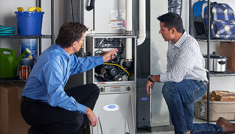 Technician evaluating a furnace for repair or replacement in Cerritos
