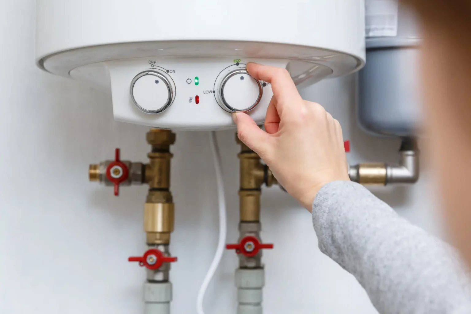 Technician adjusting a water heater in Cerritos